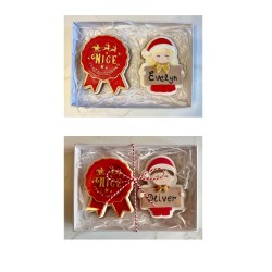 Personalised gingerbread place name and 'Nice list' rosette.